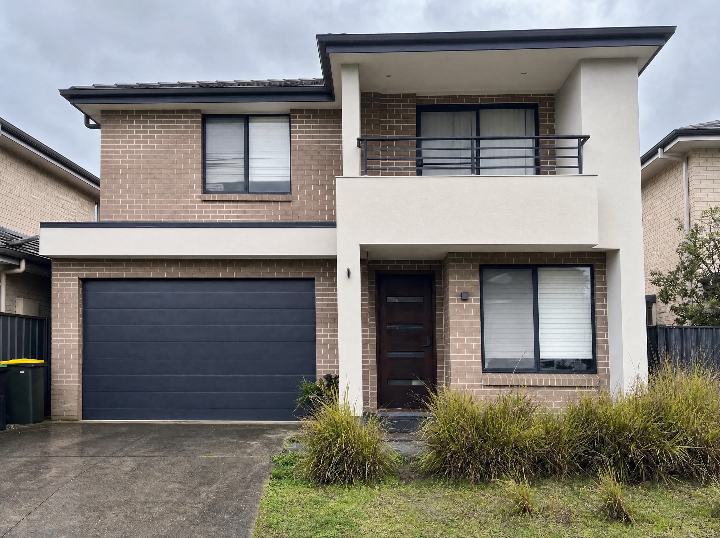 Washed render and brick house front